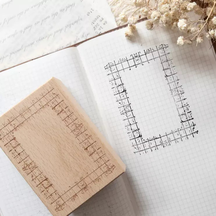 Grid Frame Rubber Stamp with its clean grid impression on printed paper styled with flowers