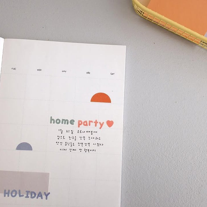 Card with 'home party' text and colourful shapes on a grey surface, from the Handwriting 3 Sticker Sheet