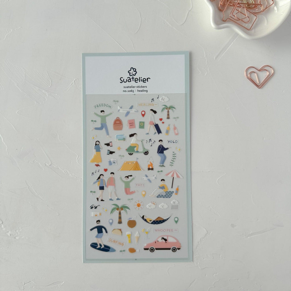 Sheet of decorative stickers with illustrations on a light gray background, featuring the brand 'Suatelier'.