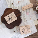 Wooden stamps with cute designs on a textured paper background