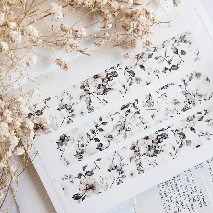 Homebody Washi Tape floral pattern styled on an open book with dried flowers alongside