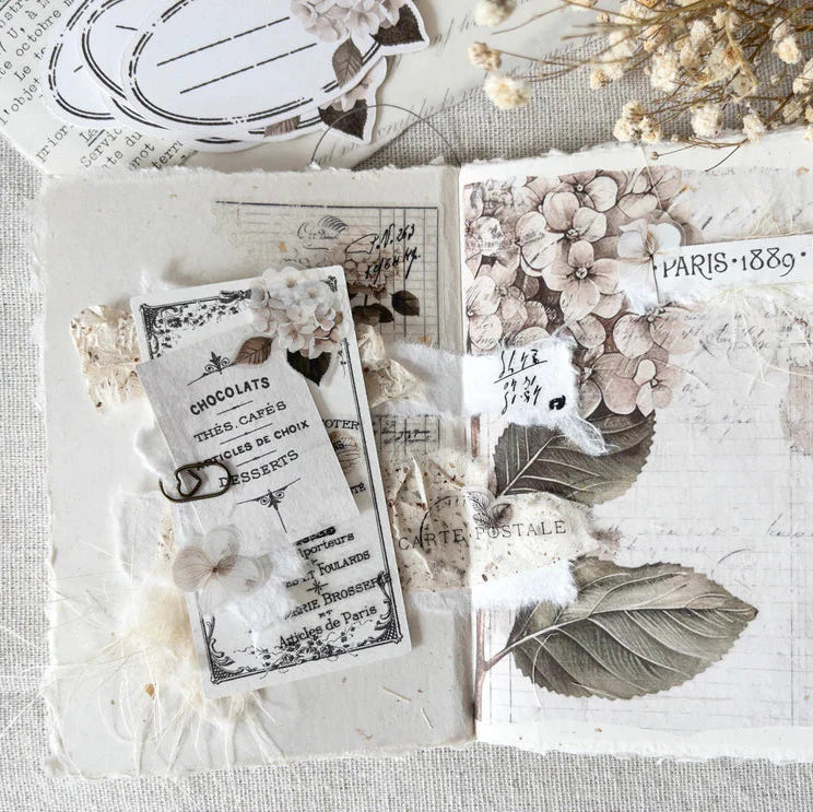 Hortensia PET Tape delicate floral and leaf designs displayed on a textured craft surface