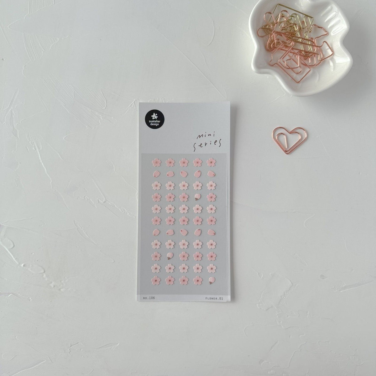 Decorative stickers with a heart-shaped paper clip on a light grey surface, from the Flower 01 Sticker Sheet