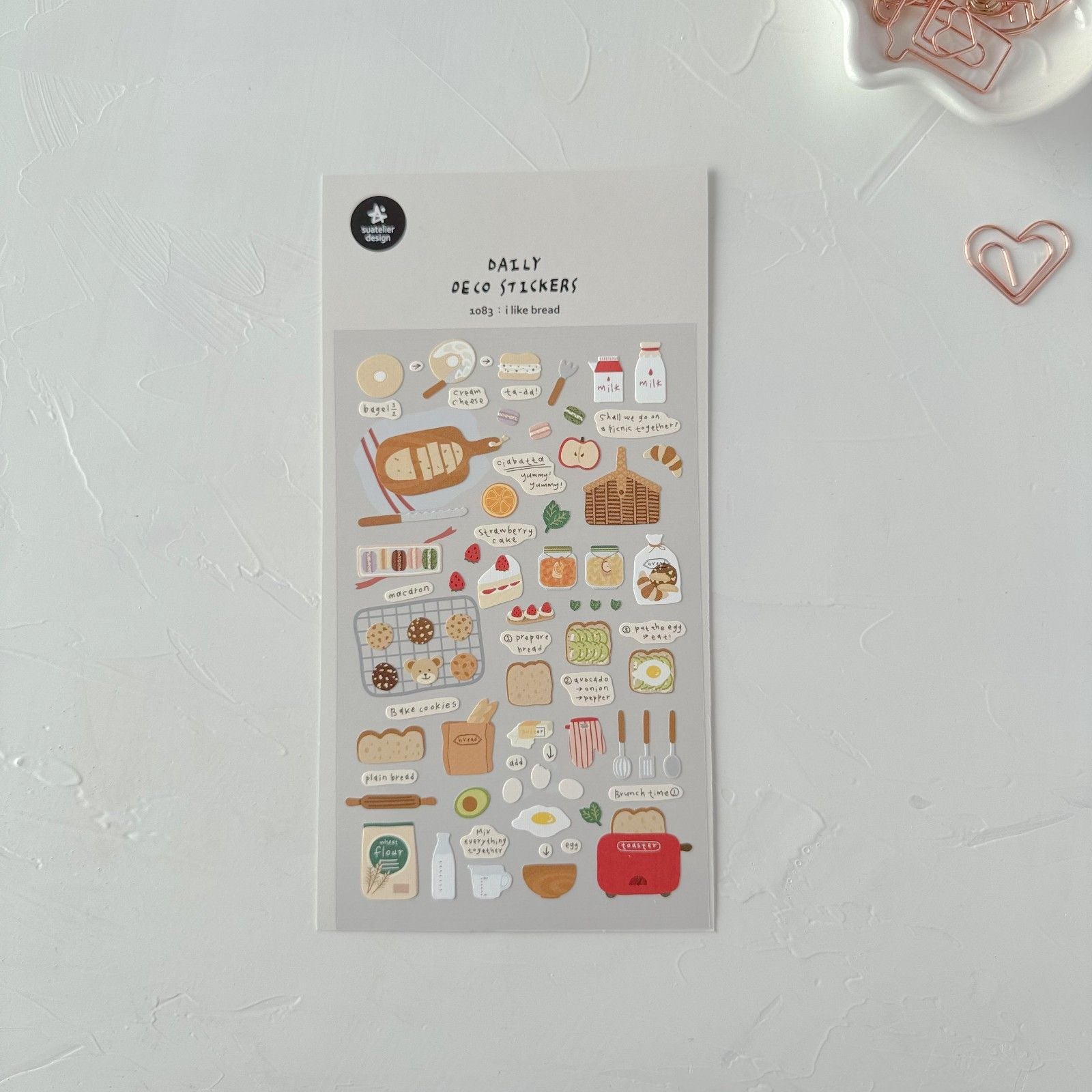 Sheet of decorative stickers with food-themed designs on a light gray background
