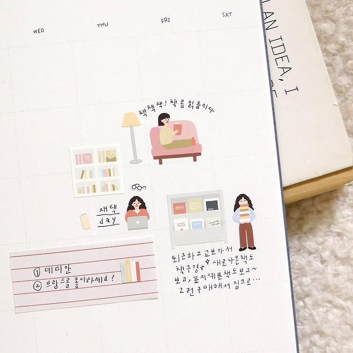 Notebook with illustrated stickers and text on a textured surface, from the In The Library Sticker Sheet