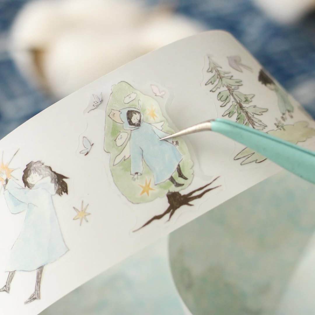 Jiji On The Cloud PET Tape fairy-like illustrations on paper with a pen on a textured surface