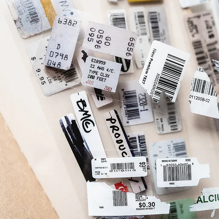 Collection of barcode labels scattered on a surface