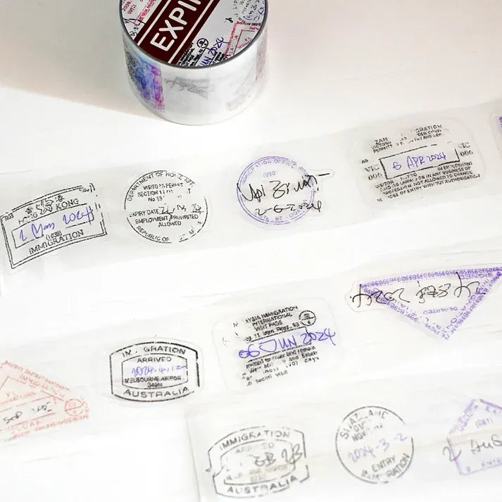 Expired Visa Stamp PET Tape kiss-cut passport stamp designs laid out across a white surface