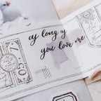 Sheet of paper with 'as long as you love me' text and decorative elements on a light background.