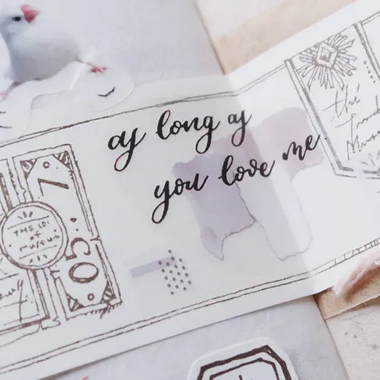 Latte PET Tape phrase as long as you love me applied to paper with deco elements on a light backdrop