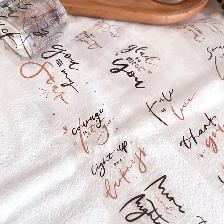 White paper towel with printed phrases on a wooden surface