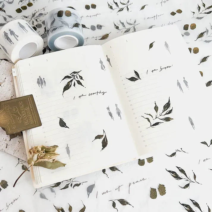 Open notebook spread decorated with Leaves PET Tape designs beside matching tape sheets, top view