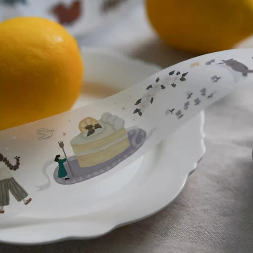 Lemon Tree PET Tape cake illustration styled on a plate with fresh lemons in the background