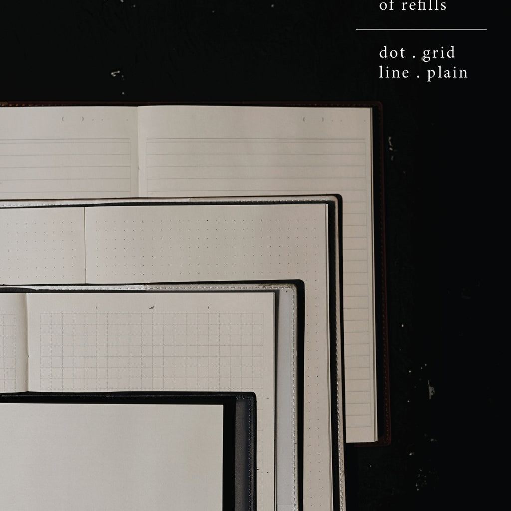 Set of lined and grid paper sheets on a black background