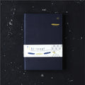 Navy blue notebook with a white label featuring 'kintsugi' on a dark textured background