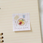 Notebook with a 'Lunch time' illustration on a lined notebook page