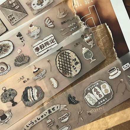 Set of Kissaten Cafe PET Tape nostalgic cafe motifs shown on a clear sheet, overhead detail view