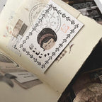 Card with a decorative design on top of an open book