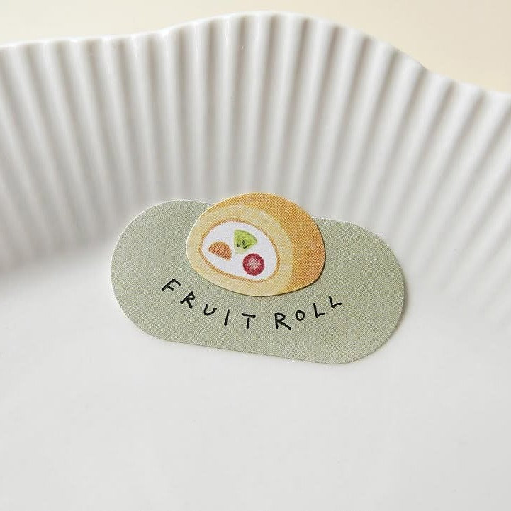 Sticker of a fruit roll-up with 'Fruit Roll' text, from the Kissaten Sticker Sheet