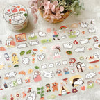 Cute transparent PET tape stickers featuring a fluffy white dog, rainbow, bench, flowers, and butterflies on a soft floral background.