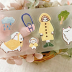Decorative PET tape stickers showing a white dog in a tent, camper van, heart shapes, and warm-toned outdoor elements.