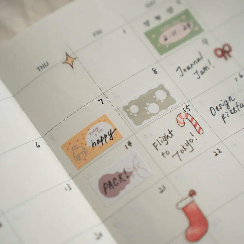 Calendar page decorated with Kuma Label Sticker Tape designs and text on a white background