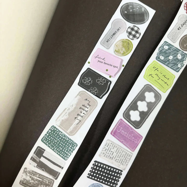 Label Paper Label Sticker Tape by Pion with precut deco designs displayed on a dark surface