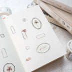 White box with floral designs on a light background