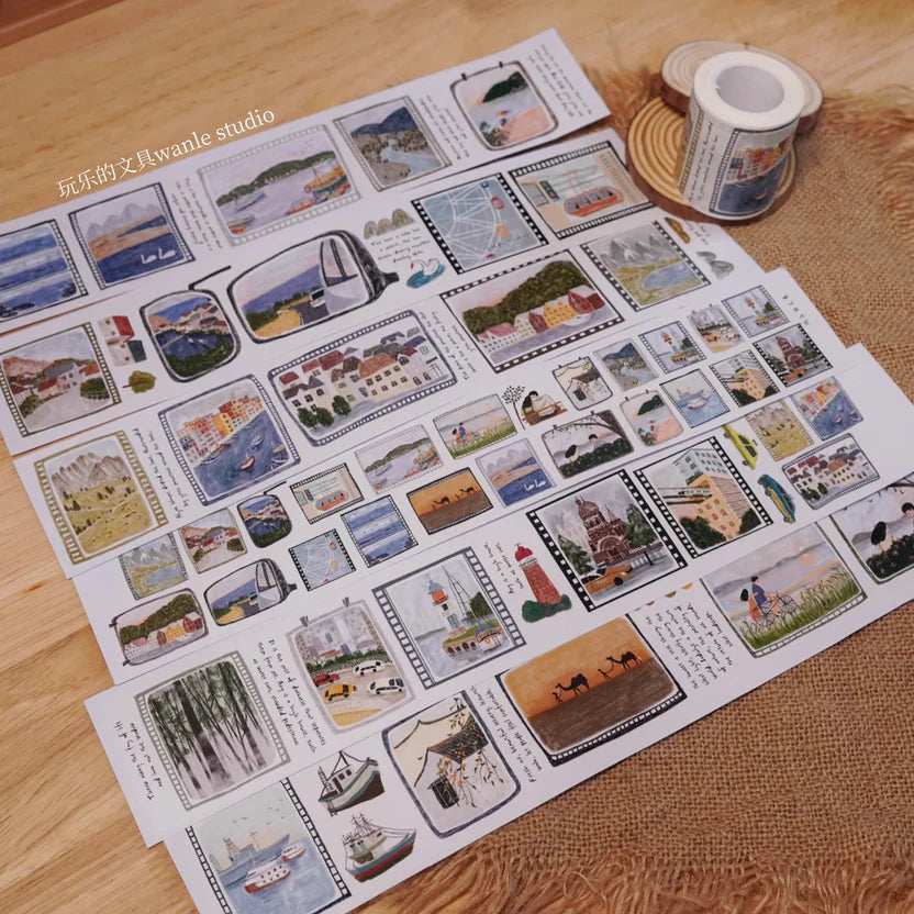 Sheet of decorative stickers with scenic and everyday scenes on a wooden surface.