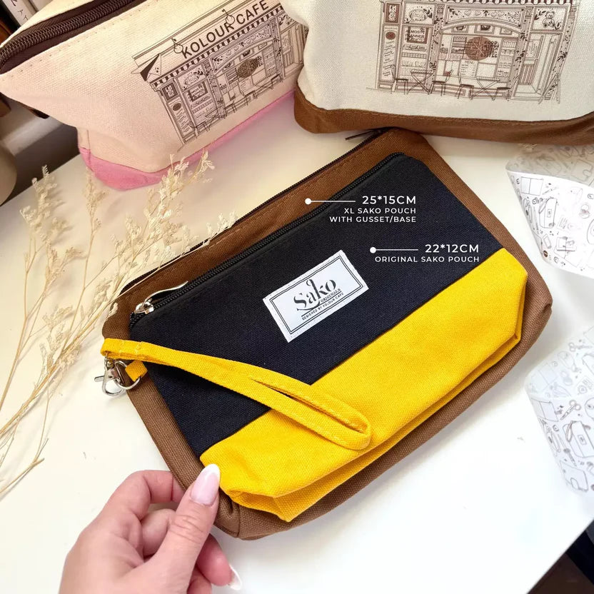 Large Pen Pouch by Kolour Cafe in brown and yellow with visible brand logo on a light surface