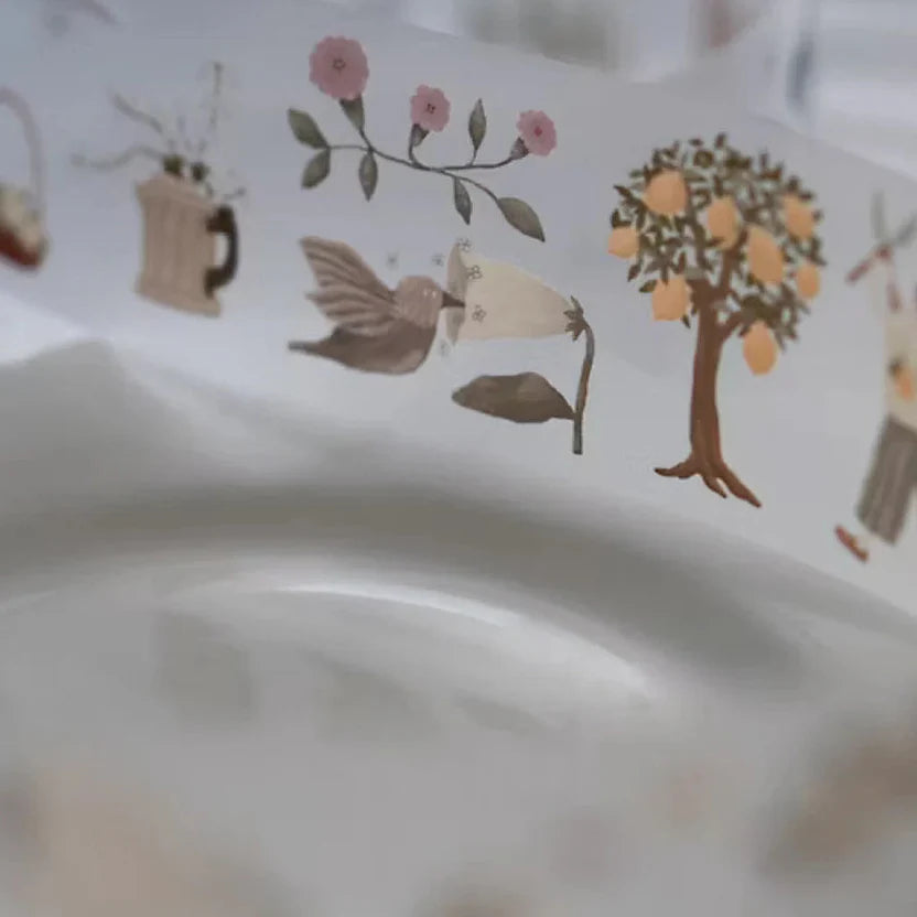 Close-up of Lemon Tree PET Tape tree, bird and flower motifs styled on a ceramic plate
