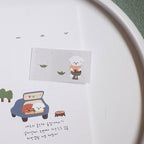 Calendar with cartoon dog illustration on a white surface