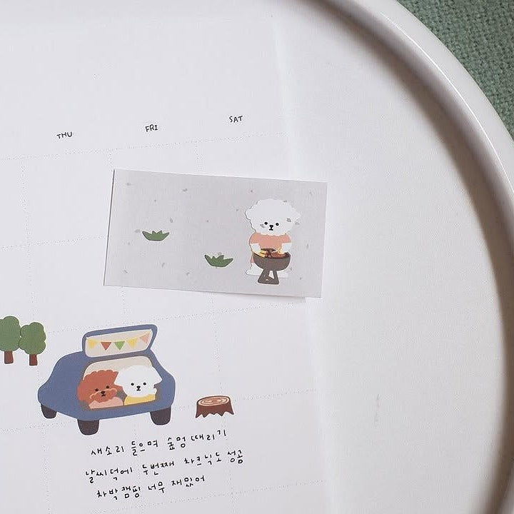 Calendar with a cartoon dog illustration, from the Let's go Camping Sticker Sheet