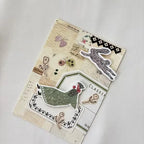 Decorative notebook with farm-themed stickers on a light gray background