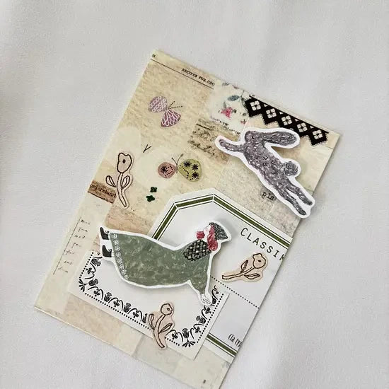 Notebook decorated with Letter Washi Tape farm-themed designs on a light grey backdrop