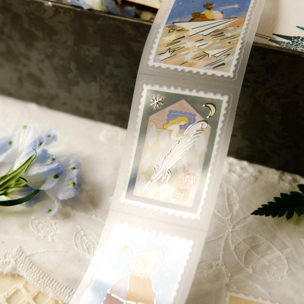 Set of tarot cards in a clear plastic sleeve on a textured surface with flowers.