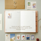 Open daily journal with postcard layout on a light gray background