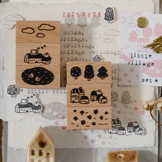 Little Village Rubber Stamps Set A with miniature village and nature designs on a textured surface
