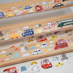 Wooden toy with colorful vehicle stickers on a white background