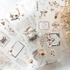 Collage of floral and vintage-style stationery elements on a textured surface.