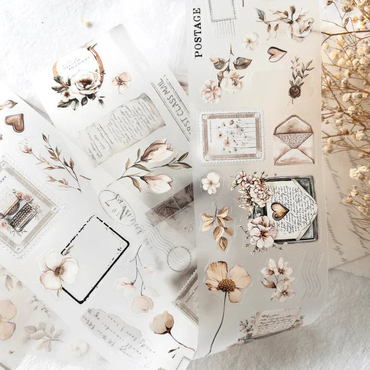 Collage of Love Letters PET Tape floral and vintage stationery elements, overhead styled craft view