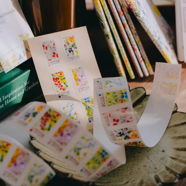 Roll of Luminous Label Sticker Tape with dreamy floral labels displayed on a table