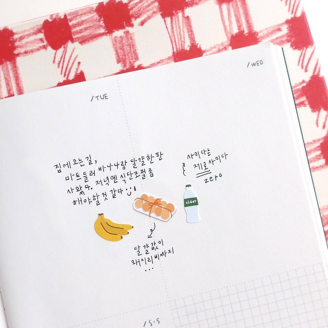 Notebook page with banana and bottle drawings on a checkered background, from the Market Sticker Sheet
