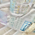 Set of washi tape rolls with floral designs on a marble surface