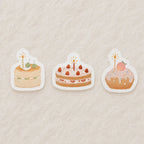 Set of three aesthetic birthday cake memo pads featuring cherry cake, strawberry cake, and donut cake designs in pastel tones