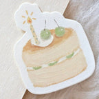 Minimal aesthetic birthday cake memo pad with layered sponge, cream filling, green cherries, and a candle detail