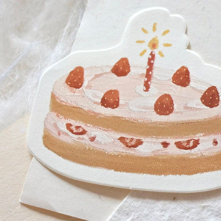 Hand-drawn style Happy Birthday Memo Pad strawberry cake sheet with a lit candle on top