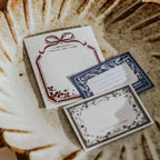 Three decorative cards with intricate designs on a textured surface