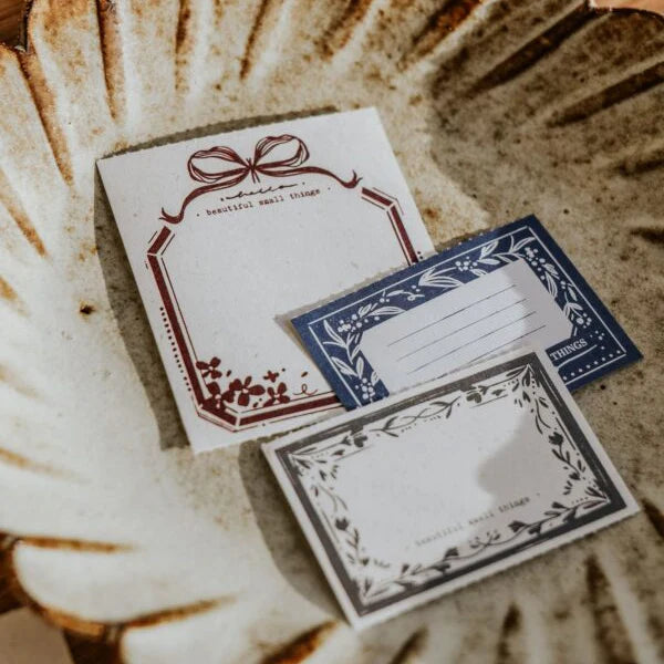 Three You Got Mail Memo Pad sheets with ornate border designs on a textured surface