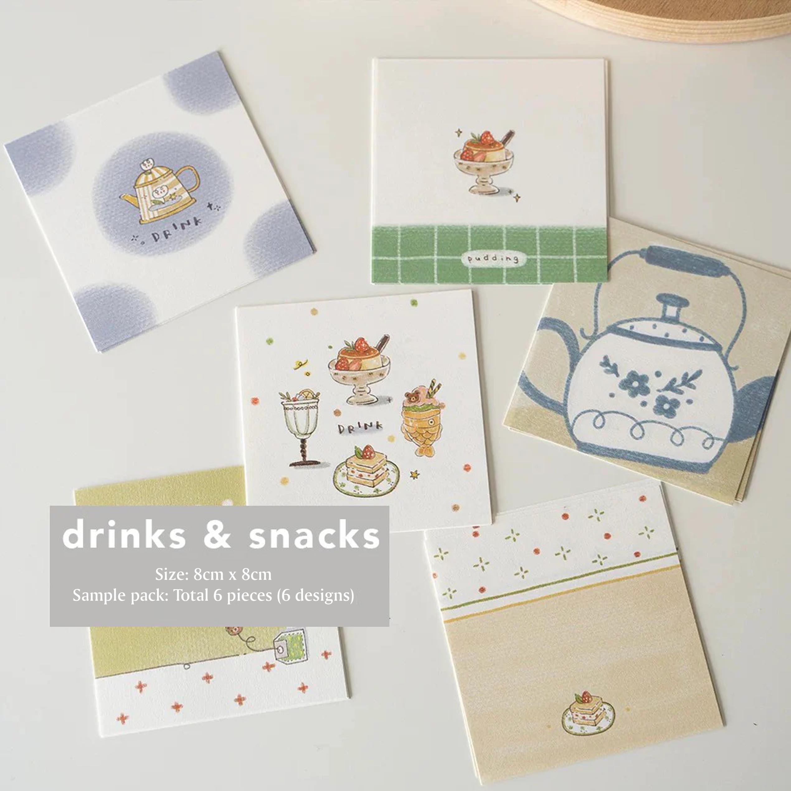 Set of small cards with tea-themed illustrations on a white surface